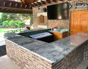 Custom Outdoor Kitchen Island with Built-In Chef's Grill and Granite Countertops
